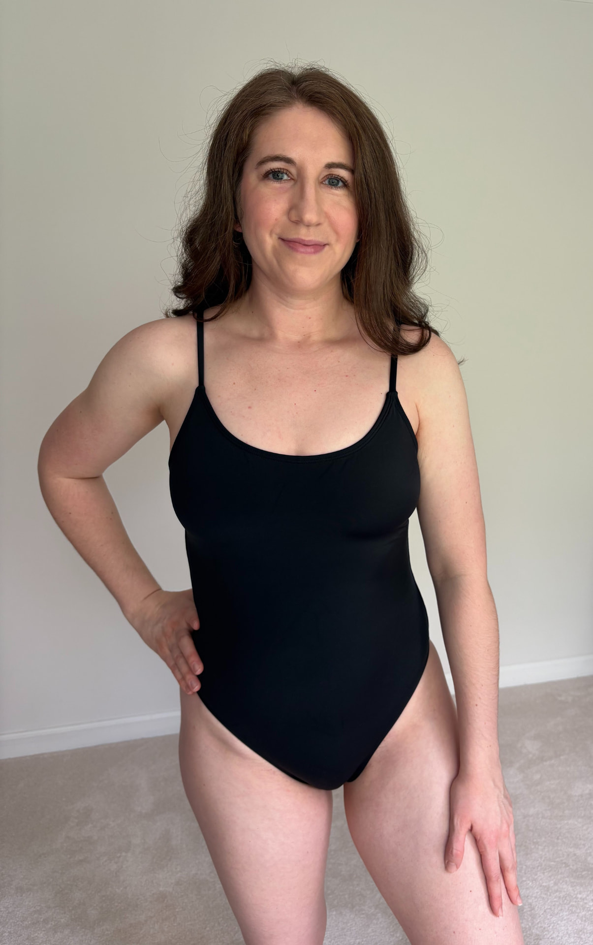 Creator filming a swimwear fit-check UGC video